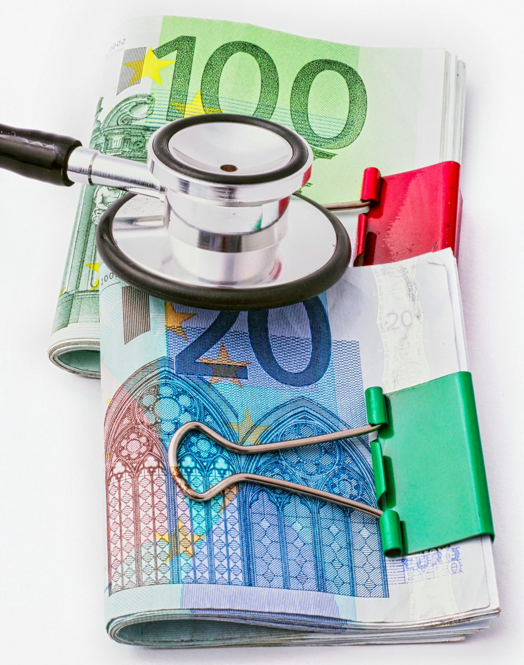 a-stethoscope-sitting-on-top-of-a-pile-of-money-xtaej3sqd-q